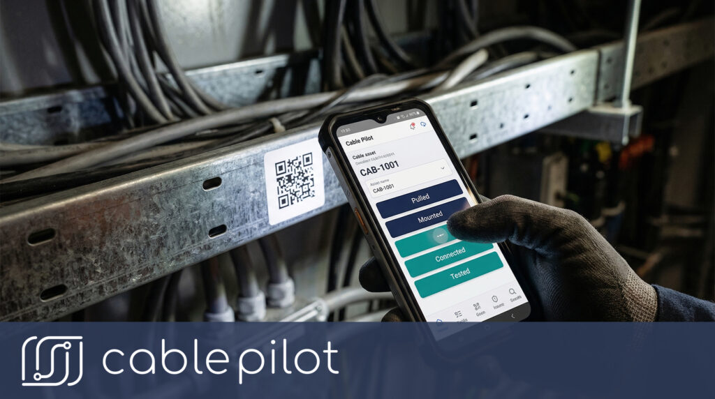 Shipyard team reviewing real-time cable installation status to improve shipbuilding efficiency